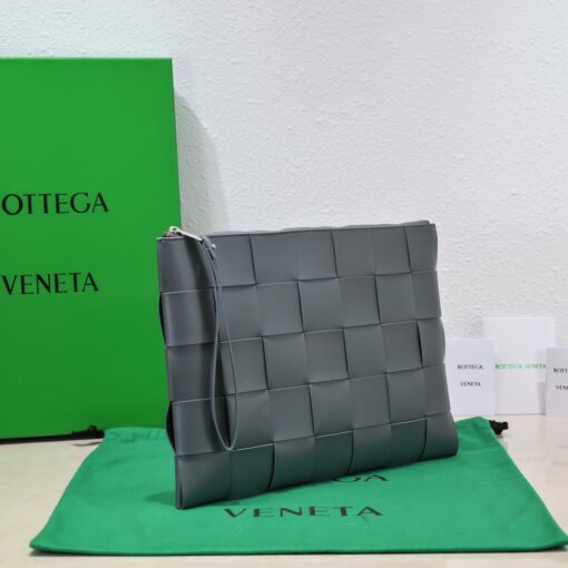 BOTTEGA VENETA Large Intreccio Leather Pouch.  High-End Quality Bag including gift box, care book, dust bag, authenticity card. This stylish zipped pouch from Bottega Veneta is a handy accessory to have. It is expertly crafted from a luxurious leather featuring the signature Intreccio weave. It features a removable wristlet so you can carry it however you desire. It also has a smooth leather interior lining which adds to its fine quality. It closes with a reliable metal zipper that runs across the top. Its multifunctional design makes it an essential addition to any wardrobe. | CRIS AND COCO Authentic Quality Luxury Accessories