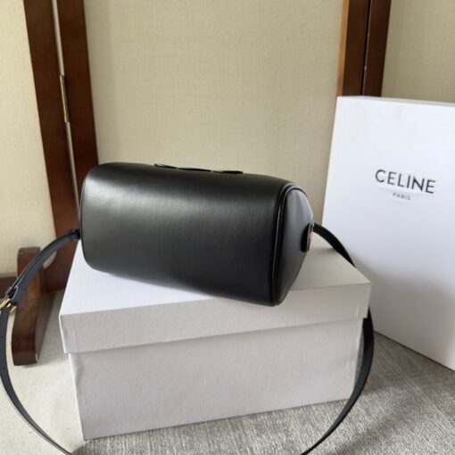 CELINE Small Boston Cuir Triomphe. Style meets sophistication with this timeless Celine Bag. The Celine Small Boston Cuir Triomphe is a classic accessory that is perfect for both day and night. It is made out of smooth calfskin leather with a stitched monogram pattern that creates an elegant, modern look. The bag features a removable and adjustable shoulder strap, a top handle for carrying, and a zipped closure. It also has a main spacious compartment, and one inner flat pocket. It has a small and compact size, perfect for days when you don't want to carry too much. The timeless design will never go out of style, and you'll be sure to feel confident and stylish with this bag on your arm. | CRIS AND COCO Authentic Quality Luxury Accessories