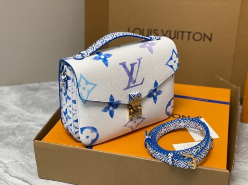 LOUIS VUITTON Pochette Métis MM. Style with a Portuguese Touch. This exquisite Pochette Metis handbag is crafted from cream-colored canvas and highlighted by pastel LV's and Monogram Flowers printed with a watercolor-like effect. The top handle and detachable strap present a more prominent Monogram Flower pattern, reminiscent of the Portuguese painted ceramic tilework. | CRIS&COCO Authentic Quality Designer Bags and Luxury Accessories