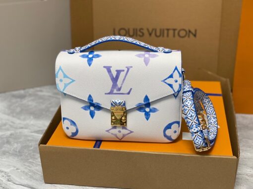 LOUIS VUITTON Pochette Métis MM. Style with a Portuguese Touch. This exquisite Pochette Metis handbag is crafted from cream-colored canvas and highlighted by pastel LV's and Monogram Flowers printed with a watercolor-like effect. The top handle and detachable strap present a more prominent Monogram Flower pattern, reminiscent of the Portuguese painted ceramic tilework. | CRIS&COCO Authentic Quality Designer Bags and Luxury Accessories