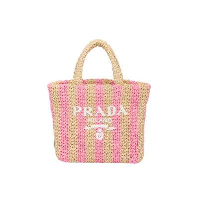 PRADA Small Crochet Tote Bag. Elevate Your Look with an Exquisite Tote Bag! This exquisite tote bag has a deconstructed design made of a light, natural material with a summery mood, raffia-effect yarn. Embroidered lettering logo decorates the front, and the emblematic triangle in enameled metal is the perfect finishing touch to the side. | CRIS&COCO Authentic Quality Designer Bags and Luxury Accessories