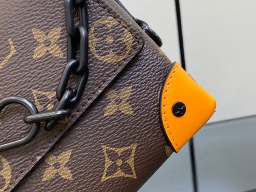 LOUIS VUITTON Steamer Wearable Wallet. Style meets function: Elevate your everyday. The Steamer Wearable Wallet is a tasteful creation that draws inspiration from the timeless design codes of our House's classic Steamer bags. Crafted with utmost precision, this wallet is constructed with durable Monogram Macassar canvas and features reinforced saffron leather corners for added strength. The use of black metal hardware, including rivets on the corners and a steamer-style chain, adds a touch of elegance to this piece. Rest assured, your valuables will be kept safe and organized with the inclusion of an inside zipped pocket. | CRIS&COCO Authentic Quality Designer Bags and Luxury Accessories