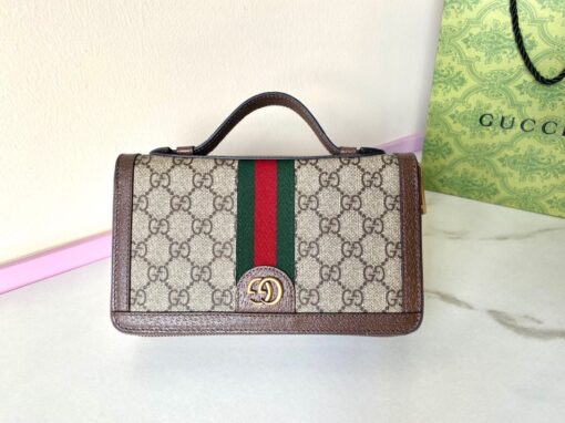 GUCCI Jumbo GG Travel Document Case. Embrace Timeless Luxury: Secure Your Journey with Gucci's Iconic GG Document Case. The iconic GG design makes a comeback for Pre-Fall 2023, adorning a range of small leather items. Paying homage to Guccio Gucci's initials, this motif remains timeless for the brand, showcased prominently in a large size to create a striking logo effect. In this particular case, the emblematic leather defines a travel document holder, ensuring security with a zip closure. | CRIS&COCO Authentic Quality Designer Bags and Luxury Accessories