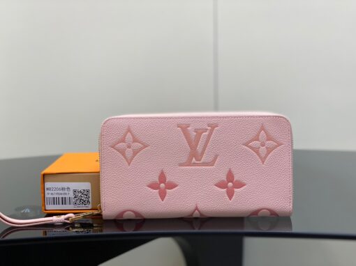 LOUIS VUITTON Zippy Wallet – Where Luxury Meets Functionality. Presenting the exquisite Zippy wallet, a coveted piece from the LV Gradient collection for this season. Meticulously fashioned using grained, embossed Monogram Empreinte leather, it showcases a gracefully transitioning spectrum of summery hues. This iconic wallet is distinguished by its sleek, slender profile, dependable zip closure, and ingeniously designed interior replete with an array of card slots, pockets, and compartments, ensuring both style and functionality in one harmonious package. | CRIS&COCO Authentic Quality Designer Bags and Luxury Accessories