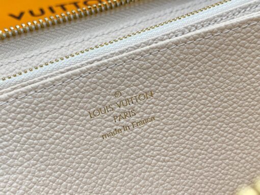 LOUIS VUITTON Zippy Wallet – Where Luxury Meets Functionality. Presenting the exquisite Zippy wallet, a coveted piece from the LV Gradient collection for this season. Meticulously fashioned using grained, embossed Monogram Empreinte leather, it showcases a gracefully transitioning spectrum of summery hues. This iconic wallet is distinguished by its sleek, slender profile, dependable zip closure, and ingeniously designed interior replete with an array of card slots, pockets, and compartments, ensuring both style and functionality in one harmonious package. | CRIS&COCO Authentic Quality Designer Bags and Luxury Accessories