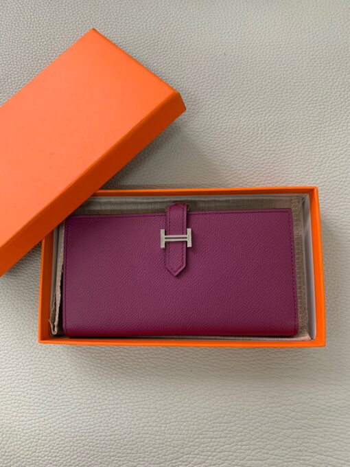 HERMÈS Béarn Wallet: Where Elegance Meets Functionality, Inspired by the Heart of France's South-West. The Béarn pays homage to the enchanting South-West region of France and stands as a distinguished member of a collection that honors various distinctive French regions. This wallet or card holder boasts an elegantly sleek design and is thoughtfully equipped with multiple compartments tailored for organizing credit cards, coins, and bills with ease. Upon closure, a supple leather flap gracefully glides into an iconic "H" shaped clasp, elevating it to a timeless classic. It presents a generous array of leather types and colors, allowing one to harmonize effortlessly with the latest trends in style. | CRIS&COCO Authentic Quality Designer Bags and Luxury Accessories