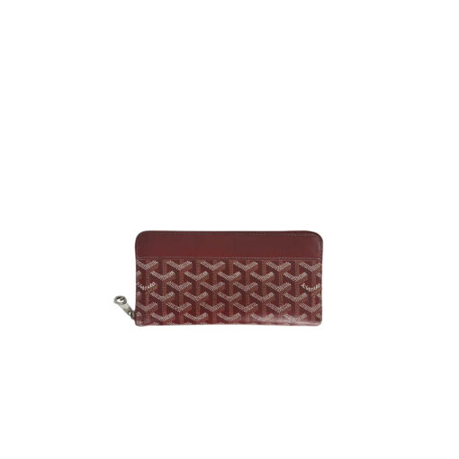 GOYARD Matignon GM Wallet: A Statement of Elegance and Functionality. Experience luxury and functionality with the Goyard Matignon GM Wallet. Crafted from premium calf leather and Goyardine canvas, it offers twelve card slots, a zipper pocket, and two spacious compartments, all secured by a snap button closure. Handcrafted by skilled artisans, Whether you're running errands or gracing a formal occasion, this wallet is the ultimate style companion. Choose from an array of colors to reflect your personality and elevate your ensemble. With this wallet, you'll not only radiate elegance but also experience unparalleled functionality.