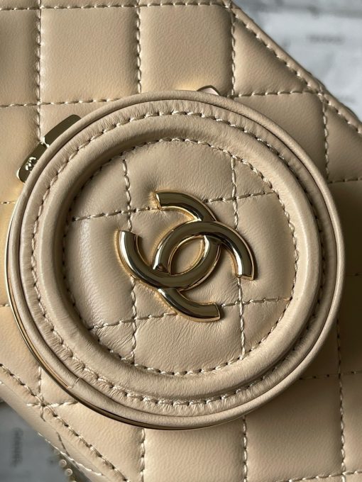 CHANEL Camera Bag. A pinnacle of timeless elegance and contemporary sophistication. This iconic piece showcases exquisite craftsmanship and meticulous attention to detail. The camera bag design exudes versatility and style, offering a modern reinterpretation of a classic silhouette. Made from premium materials, it boasts buttery-soft lambskin leather, adorned with the iconic quilted pattern synonymous with CHANEL's heritage. With its compact yet spacious interior, the Camera Bag effortlessly accommodates all your essentials while maintaining a sleek and streamlined profile. The signature Chanel interlocking CC logo adorns the front, adding a touch of unmistakable luxury to the design.