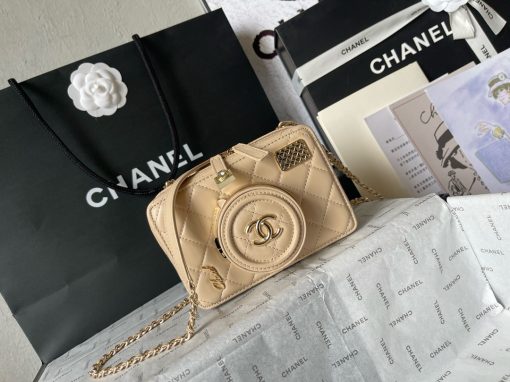 CHANEL Camera Bag. A pinnacle of timeless elegance and contemporary sophistication. This iconic piece showcases exquisite craftsmanship and meticulous attention to detail. The camera bag design exudes versatility and style, offering a modern reinterpretation of a classic silhouette. Made from premium materials, it boasts buttery-soft lambskin leather, adorned with the iconic quilted pattern synonymous with CHANEL's heritage. With its compact yet spacious interior, the Camera Bag effortlessly accommodates all your essentials while maintaining a sleek and streamlined profile. The signature Chanel interlocking CC logo adorns the front, adding a touch of unmistakable luxury to the design.