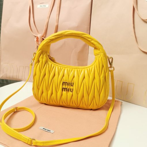 MIU MIU Wander Matelassé Mini Hobo Bag. Original Quality Bag including gift box, care book, dust bag, authenticity card. The Miu Wander bag is reinterpreted season after season, becoming an iconic accessory of Miu Miu collections. Made of matelassé nappa leather, the bag is characterized by the sophisticated, three-dimensional effect created by the refined workmanship. The hobo shape, blending retro inspirations and contemporary elegance, becomes a new synonym of modern femininity.