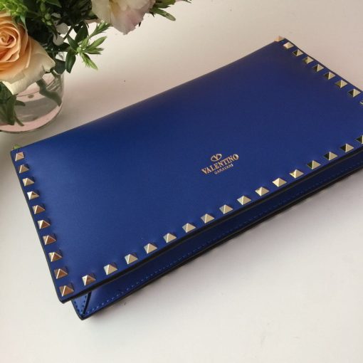 VALENTINO GARAVANI The Rockstud Leather Clutch. Original Quality Clutch. Authentic Style in Genuine Calf Leather. With Metal Hardware and Authentic Packaging. Delivered in Original Quality Dust Bag.