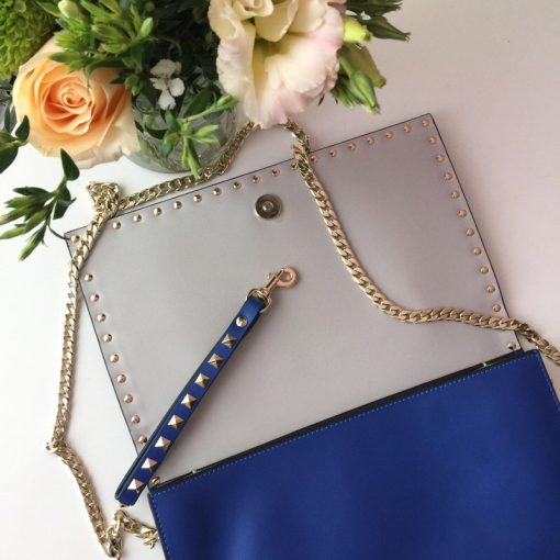 VALENTINO GARAVANI The Rockstud Leather Clutch. Original Quality Clutch. Authentic Style in Genuine Calf Leather. With Metal Hardware and Authentic Packaging. Delivered in Original Quality Dust Bag.