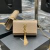 SAINT LAURENT Small 'Kate' Bag with Tassel. Original Quality Bag including gift box, care book, dust bag, authenticity card. Monogram Saint Laurent bag adorned with a curb chain, interlocking YSL initials in metal, and a metallic tassel. Crafted from leather, this Kate shoulder bag from Saint Laurent is decorated with a signature YSL monogram plaque and a hanging tassel detail to the front for an extra refined touch. The perfect go-to for a night out. Featuring a chain shoulder strap, a foldover top with magnetic closure, a main internal compartment, an internal slip pocket, an internal logo patch, an internal logo stamp, and metal hardware.