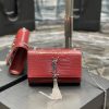 SAINT LAURENT Small 'Kate' Bag with Tassel. Original Quality Bag including gift box, care book, dust bag, authenticity card. Monogram Saint Laurent bag adorned with a curb chain, interlocking YSL initials in metal, and a metallic tassel. Crafted from leather, this Kate shoulder bag from Saint Laurent is decorated with a signature YSL monogram plaque and a hanging tassel detail to the front for an extra refined touch. The perfect go-to for a night out. Featuring a chain shoulder strap, a foldover top with magnetic closure, a main internal compartment, an internal slip pocket, an internal logo patch, an internal logo stamp, and metal hardware.