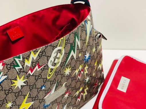 GUCCI GG Supreme Baby Changing Bag. Original Quality Bag including gift box, care book, dust bag, authenticity card. A baby changing bag crafted from Supreme canvas is animated by a print that recalls outer space–a theme used throughout Gucci's collections. Set against the House's emblematic monogram motif, the baby changing diaper bag is defined by spaceships, stars, and images from the galaxy. Also, outer space continues to influence Gucci's latest collections in new, whimsical ways.