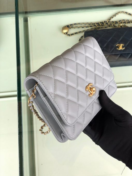 CHANEL Classic WOC Golden Knob Bag. Original Quality Bag including gift box, care book, dust bag, authenticity card. Chanel lends a signature flair to this Classic WOC bag with iconic symbols and construction. Crafted in lambskin, gold-tone hardware, and iconic CC pair together to create the ultimate memorable finish. Open this sweet little quilted bag to find multiple zip and slip pockets for keeping your cards and essentials secure so you can have more fun!