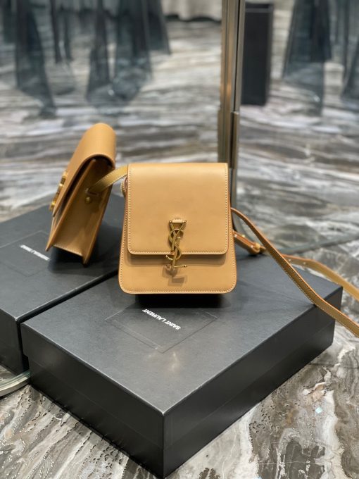 SAINT LAURENT Kaia North/South Shoulder Bag. Original Quality Bag including gift box, care book, dust bag, authenticity card. Saint Laurent's Kaia shoulder bag is named after model Kaia Gerber and was first introduced during the SS20 collection. Finished with refined gold-tone details, this elongated North/South iteration fastens with a magnetic closure and can be worn across the body or on the shoulder thanks to its adjustable strap.