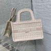 DIOR Mini Book Tote. Original Quality Bag including gift box, care book, dust bag, authenticity card. The Dior Book Tote, as imagined by Maria Grazia Chiuri, has become an essential item of the Dior aesthetic. The silhouette is fully embroidered. A prime example of Dior savoir-faire, the miniature bag may be carried by hand and can be paired with other Dior Oblique creations.