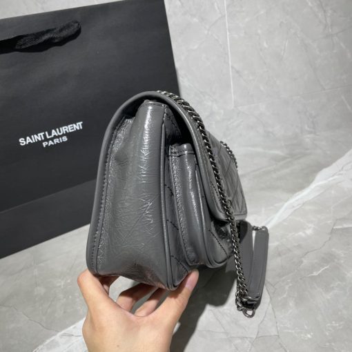 SAINT LAURENT Niki Baby in Crinkled Vintage Leather. Original Quality Bag including gift box, care book, dust bag, authenticity card. This bag is much more than a shoulder bag. It’s practical, elegant and modern. The chain really adds a nice finishing touch to it. The center comes with the signature YSL logo, which makes the bag very classy. The crinkled leather is eye-catching and creates a nice texture for the luxury experience. SAINT LAURENT monogram bag featuring a relaxed shape, a rectangular body, a quilted effect, a fold over top with magnetic closure, a front logo plaque, a main internal compartment, an internal zipped pocket, a front slip pocket and a leather convertible shoulder strap.