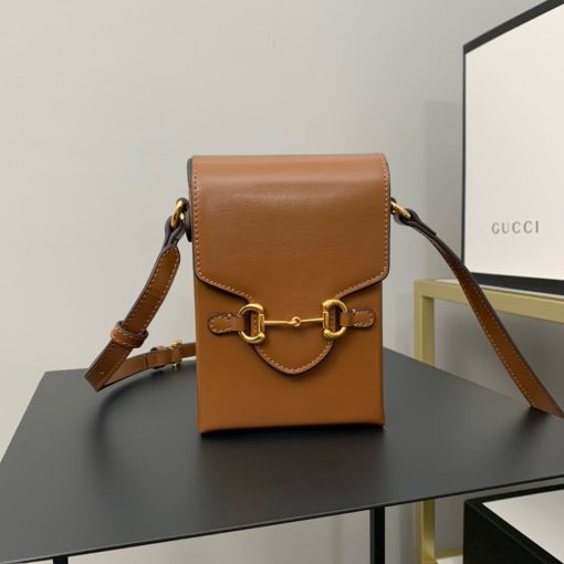 GUCCI Horsebit 1955 Mini Bag. Original Quality Bag including gift box, care book, dust bag, authenticity card. Presented in a petite rectangular shape, this mini bag is introduced for Pre-Fall 2020 in brown leather. Inspired by archival designs, the accessory highlights the double ring and bar design that has been established as one of the most distinctive elements among the House symbols borrowed from the equestrian world. Pieces with versatile ways to wear and style embrace each person who is part of the House’s individual spirit.