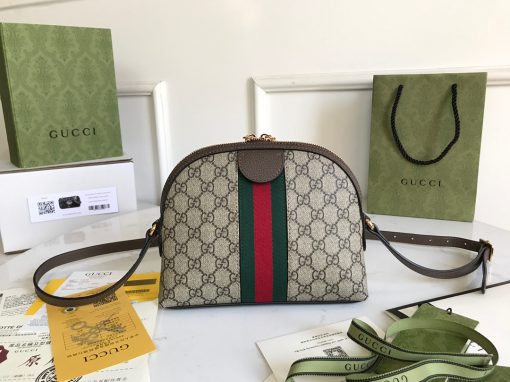 GUCCI Ophidia GG Small Rounded Top Shoulder Bag. Original Quality Bag including gift box, care book, dust bag, authenticity card. This rounded top shoulder bag is a heritage-inspired addition to accessories edit. Complete with the label's signature motifs – GG Supreme print, green and red Web, and golden-tone hardware – it's a perfect modern interpretation of coveted vintage pieces. Carry the runway design with tailored looks for effortless workwear style.