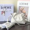 LOEWE Mini Flamenco Clutch. Original Quality Bag including gift box, care book, dust bag, authenticity card. Launched in the 1970s, the Flamenco Clutch cinches closed using drawstring pulls finished in signature coiled knots. This mini version is crafted in nappa calfskin. The Flamenco mini can hold for example a small vertical wallet, most mobile phones (up to 6.1 inches) and sunglasses case. Suitable for shoulder, crossbody or hand carry.