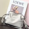 LOEWE Mini Flamenco Clutch. Original Quality Bag including gift box, care book, dust bag, authenticity card. Launched in the 1970s, the Flamenco Clutch cinches closed using drawstring pulls finished in signature coiled knots. This mini version is crafted in nappa calfskin. The Flamenco mini can hold for example a small vertical wallet, most mobile phones (up to 6.1 inches) and sunglasses case. Suitable for shoulder, crossbody or hand carry.