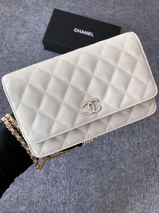 CHANEL Classic Wallet on Chain. Authentic Quality Wallet, including gift box, literature, dust bag, authenticity card. Classic and elegant, a Chanel bag is a fashion statement to your outfit, as seen in this caviar leather flap wallet on chain. Featuring a diamond quilted finish, metal-tone hardware, a foldover top, an internal zipped pocket, an internal slip pocket, an internal logo stamp, a back slip pocket, tortoiseshell details, and a CC turn-lock fastening.