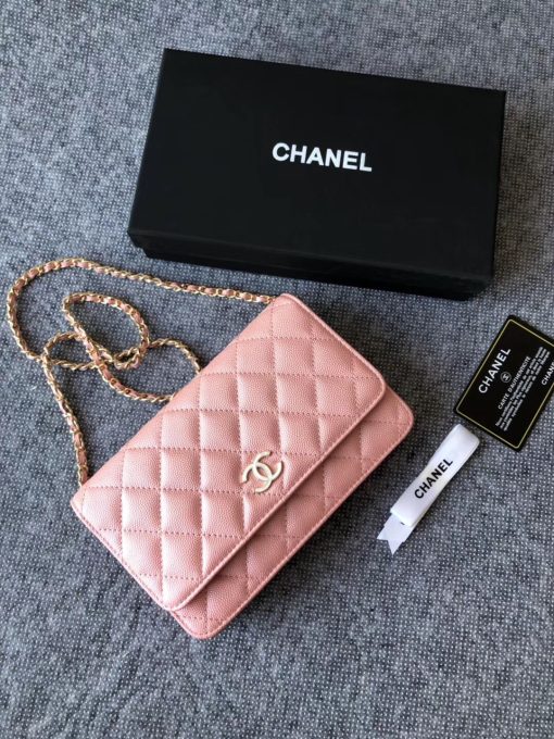 CHANEL Classic Wallet on Chain. Authentic Quality Wallet, including gift box, literature, dust bag, authenticity card. Classic and elegant, a Chanel bag is a fashion statement to your outfit, as seen in this caviar leather flap wallet on chain. Featuring a diamond quilted finish, metal-tone hardware, a foldover top, an internal zipped pocket, an internal slip pocket, an internal logo stamp, a back slip pocket, tortoiseshell details, and a CC turn-lock fastening.