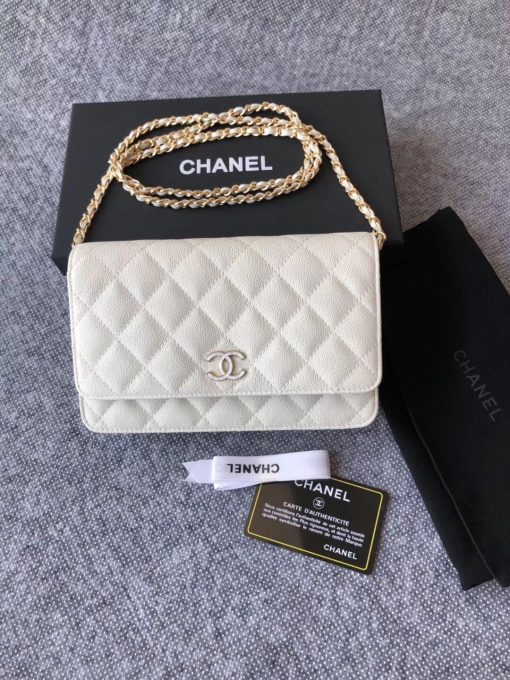 CHANEL Classic Wallet on Chain. Authentic Quality Wallet, including gift box, literature, dust bag, authenticity card. Classic and elegant, a Chanel bag is a fashion statement to your outfit, as seen in this caviar leather flap wallet on chain. Featuring a diamond quilted finish, metal-tone hardware, a foldover top, an internal zipped pocket, an internal slip pocket, an internal logo stamp, a back slip pocket, tortoiseshell details, and a CC turn-lock fastening.