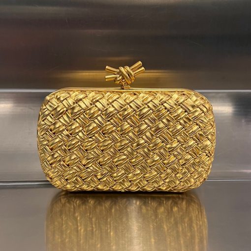 BOTTEGA VENETA Knot Clutch. Original Quality Bag including gift box, care book, dust bag, authenticity card. Bottega Veneta's intrecciato technique has rapidly become a signature style code of the Italian brand since its founding in 1966, amassing fans from across the globe. This leather clutch features a contemporary update in the form of a knot. Wear yours with vibrant outfits.