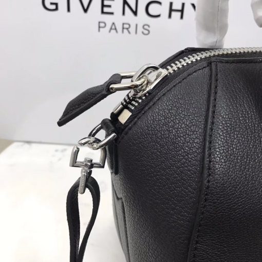 GIVENCHY Small Antigona Bag. Original Quality Wallet including gift box, care book, dust bag, authenticity card. One of the finest in detailed finished handbag ever. The style is so smooth that anyone would recognize you are carrying a top quality handbag. Just like the Nightingale, Givenchy don’t need to scream for any attention, it’s the most humble bag, a simple logo name on the front will do. But then again, the Givenchy Antigona bag is already famous, is already timeless and recognize as a classic. The structure of the bag from the inside is rather simple, but organized. You can easily find your essentials and take it out. For the convenience, Givenchy made an internal zip and patch pocket for your wallet and your phone.