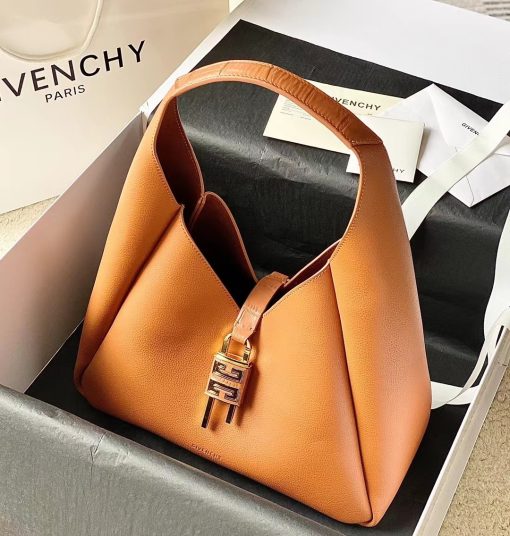 GIVENCHY Medium G-Hobo Bag. Original Quality Wallet including gift box, care book, dust bag, authenticity card. The G-Hobo Medium shoulder bag from Givenchy has a slouched, triangular silhouette. The calf leather design is a house signature style that's further embellished with the iconic 4G padlock and croc-effect straps.