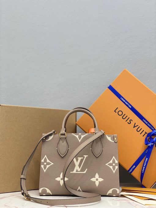 LOUIS VUITTON Onthego PM. Original Quality Bag including gift box, care book, dust bag, authenticity card. Inspired by Louis Vuitton’s famous Sac Plat from 1968, the Onthego PM tote is fashioned in Monogram Empreinte leather, embossed with a Giant Bicolor Monogram pattern. This smaller version of the original Onthego fits essentials such as an iPad Mini. Articulated top handles and an adjustable removable strap offer a variety of carry options.