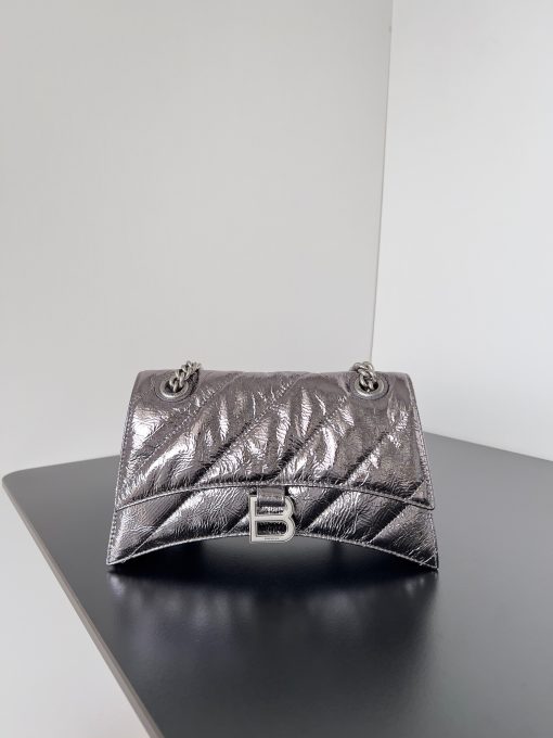 BALENCIAGA Crush Small Chain Bag. Original Quality Bag including gift box, care book, dust bag, authenticity card. Crush on this metallic Crush Chain Bag. This is a new iteration on their celebrated curvilinear design, complete with tonal B logo hardware and shoulder and crossbody chain. Crafted in a contemporary crushed quilted calfskin.