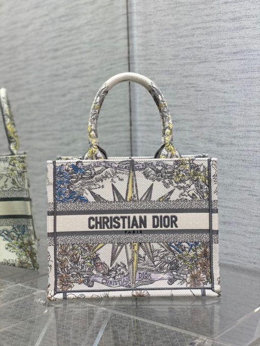 DIOR Small Book Tote. Original Quality Bag including gift box, care book, dust bag, authenticity card. This DIOR Tote is an original creation introduced by Dior's Creative Director, Maria Grazia Chiuri, and has become a staple of the Dior aesthetic. Designed to hold all the daily essentials, it is fully embroidered. Adorned with a Christian Dior Paris signature on the front, the small tote exemplifies the House's signature savoir-faire and may be carried by hand.