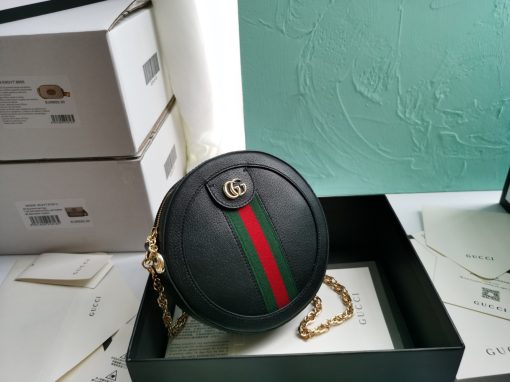 GUCCI GG Marmont Mini Leather Round Shoulder Bag. This Gucci GG Marmont mini round shoulder bag certainly seems to fit the bill! Mini bags are hot this season and we could be more supportive of this trend. This bag from Gucci is only for essentials, the phone will be on your hands, the credit card in your pocket and your lipstick have a 24-hour duration. Crafted from plain/quilted leather, this fun-size accessory has a chain and leather shoulder strap and is adorned with the signature metal GG logo. All the best things come in small packages. Featuring a top zip fastening and gold-tone/silver-tone hardware.