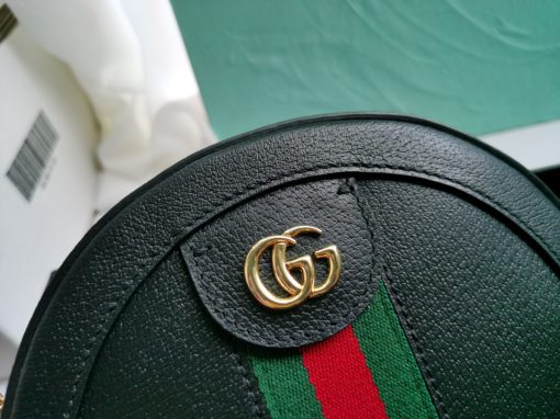 GUCCI GG Marmont Mini Leather Round Shoulder Bag. This Gucci GG Marmont mini round shoulder bag certainly seems to fit the bill! Mini bags are hot this season and we could be more supportive of this trend. This bag from Gucci is only for essentials, the phone will be on your hands, the credit card in your pocket and your lipstick have a 24-hour duration. Crafted from plain/quilted leather, this fun-size accessory has a chain and leather shoulder strap and is adorned with the signature metal GG logo. All the best things come in small packages. Featuring a top zip fastening and gold-tone/silver-tone hardware.