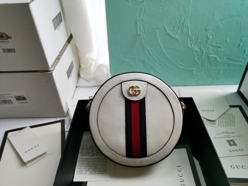 GUCCI GG Marmont Mini Leather Round Shoulder Bag. This Gucci GG Marmont mini round shoulder bag certainly seems to fit the bill! Mini bags are hot this season and we could be more supportive of this trend. This bag from Gucci is only for essentials, the phone will be on your hands, the credit card in your pocket and your lipstick have a 24-hour duration. Crafted from plain/quilted leather, this fun-size accessory has a chain and leather shoulder strap and is adorned with the signature metal GG logo. All the best things come in small packages. Featuring a top zip fastening and gold-tone/silver-tone hardware.