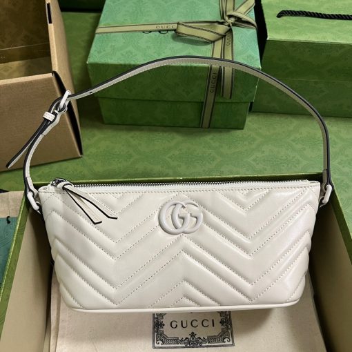 GUCCI GG Marmont Shoulder Bag. Original Quality Bag including gift box, care book, dust bag, authenticity card. The GG Marmont has become synonymous with the House, thanks to its recognizable matelassé fabric and Double G hardware. Continuously reinvented through the seasons, new shapes are introduced within this signature line, matching Gucci's contemporary vision. Presented here in chevron leather, it's further enriched with tonal details.