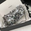 CHANEL Mini Flap Bag In Sequins.  Original Quality Bag including gift box, care book, dust bag, authenticity card. This small sleek flap bag is beautifully crafted of the layering of small and large sequins that create the entire surface of the bag. The elegant handbag features polished chain link leather threaded shoulder straps and a Chanel CC turn lock. This opens to a leather interior with room for your necessities for day or evening with the timeless style.