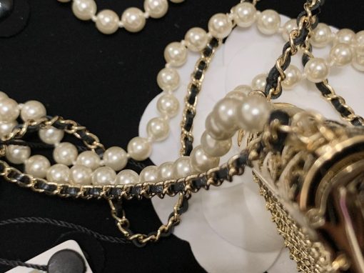 CHANEL Long Necklace. This CHANEL Long Necklace- Gold, Black & Pearly White is part of the Spring-Summer 2021 fashion collection. The artistry and craftsmanship of the House of CHANEL.