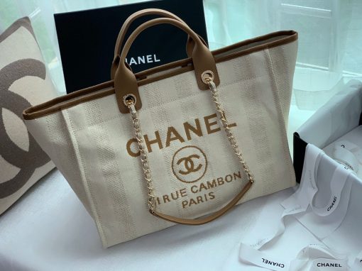 CHANEL Large Deauville Shopping Bag 2021. Authentic quality bag including gift box, booklet, dust bag, authenticity card. The CHANEL Deauville tote matured to a signature CHANEL bag. The bestseller Deauville often appears in seasonal launches in unexpected colors and materials. On the CHANEL website, Chanel calls it the Shopping Bag, but if you walk into a CHANEL boutique and ask for the Deauville, you will be directed to this tote bag.