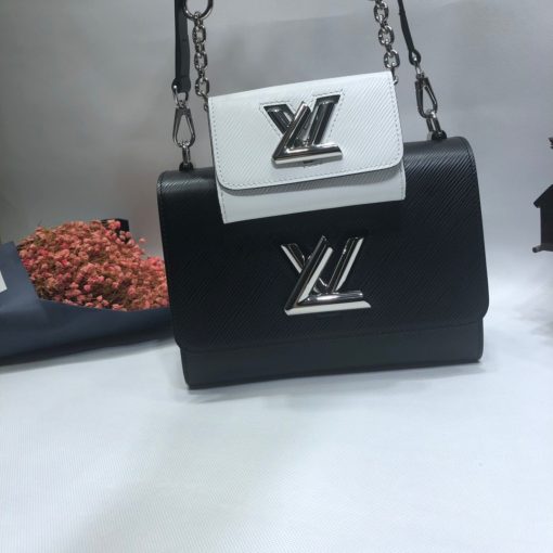 LOUIS VUITTON Twist MM And Twisty Bag. Authentic Quality Bag including gift box, literature, dust bag, authenticity card. Charm Bags are so fashionable right now. The Twist Bag has become LOUIS VUITTON’s top seller. It is now as famous as the Speedy bag. For this season, the house created a mini charm twist bag and attached it right in the center as extra storage. This charm can be detached and used in another bag. The mini Twist Bag is called Twisty and it is for carrying cards, coins, and more.