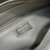PRADA Nappa Antique Leather Shoulder Bag. High-End Quality Bag including gift box, care book, dust bag, authenticity card. This bag with compact allure is made of nappa leather with a natural, glossy finish. The hand-made wrinkled effect contrasts with the constructed and rigid concept, reinterpreting an everyday object to be worn without constraints. Presented in the Spring Summer 2023 show, the style is accented with a finely embroidered shoulder strap with a sporty mood.