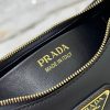 PRADA Leather Shoulder Bag.  High-End Quality Bag including gift box, care book, dust bag, authenticity card. This sleek leather bag expresses versatile, modernist allure. The accessory with a curvy silhouette is completed by the leather extension for versatile wear. With a nappa leather lining and metal hardware, the bag is accented with the iconic enameled metal triangle logo on the front.