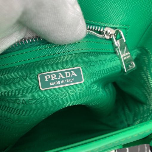 PRADA Galleria Micro Bag. Original Quality Bag including gift box, care book, dust bag, authenticity card. Prada has always been synonymous with transformation and experimentation with new fashion rules. The Prada Galleria bag, an expression of timeless elegance, is made of Prada's iconic Saffiano leather: leather defined by its crosshatch texture and waxed finish. With gimmicky hardware, usual shape and subtle style the bag is perfect for work, and also its truly practical with a shoulder strap. The bag owes its name to the historic Prada store that Mario Prada opened back in 1913 in Galleria Vittorio Emanuele II in Milan. 