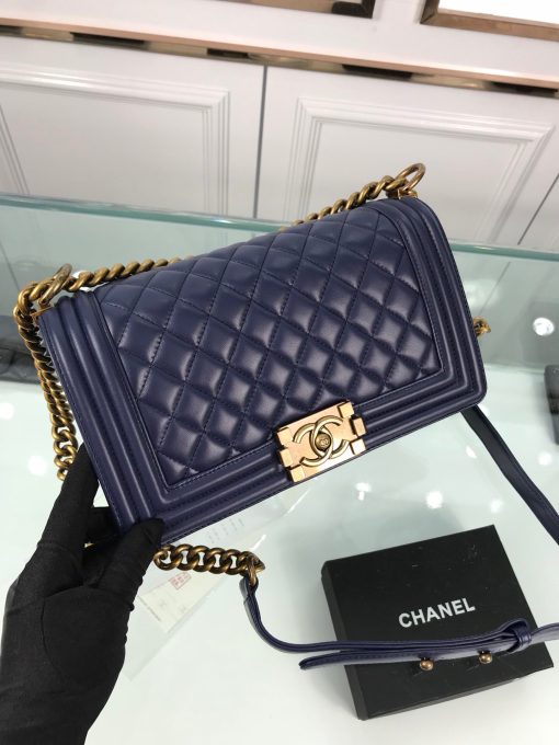 CHANEL Boy Quilted Leather Flap Bag. Original Quality Bag including gift box, literature, dust bag, authenticity card. This stand-out, enviable CHANEL Boy quilted flap bag features a chunky chain-link strap with shoulder pad, CC Boy logo push-lock closure, and antiqued hardware accents. Its push-lock closure opens to a black fabric-lined interior with side zip and slip pockets to secure daily essentials.