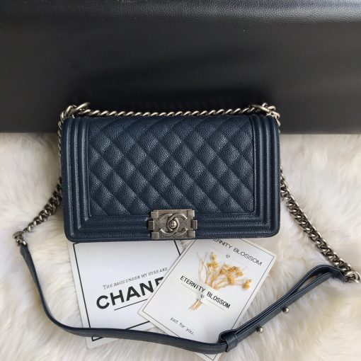 CHANEL Boy Quilted Leather Flap Bag. Original Quality Bag including gift box, literature, dust bag, authenticity card. This stand-out, enviable CHANEL Boy quilted flap bag features a chunky chain-link strap with shoulder pad, CC Boy logo push-lock closure, and antiqued hardware accents. Its push-lock closure opens to a black fabric-lined interior with side zip and slip pockets to secure daily essentials.