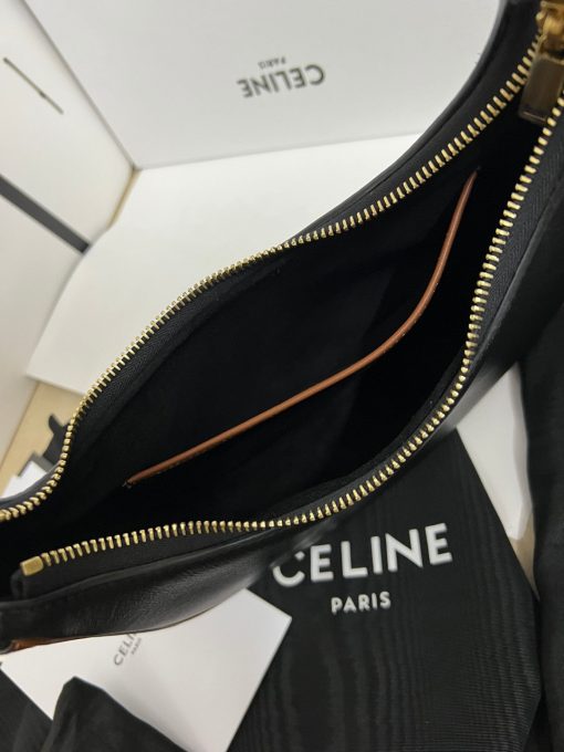 CELINE Medium Ava Strap Bag. High-End Quality Bag including gift box, care book, dust bag, authenticity card. Celine's Ava bag is a perfect example of the brand's signature style, with powerful understated elegance. Crafted from a variety of materials, including iconic leather and textiles with the stylish Celine logo plastering the surface, the bag is a classic with a hint of '80s-inspired blouson. Taking inspiration from the iconic Arc de Triomphe, the logo features two opposites-facing Cs and a patterned center. The minimalist aesthetic of the new logo and colors perfectly encapsulates the essence of the brand. The semi-moon silhouette and adjustable shoulder straps allows the bag to be styled any number of ways, making it perfect for someone who carries minimal items on a daily basis without needing a crossbody strap. With enough room for the essentials, the Celine Ava bag is an ultimate cool-girl essential.